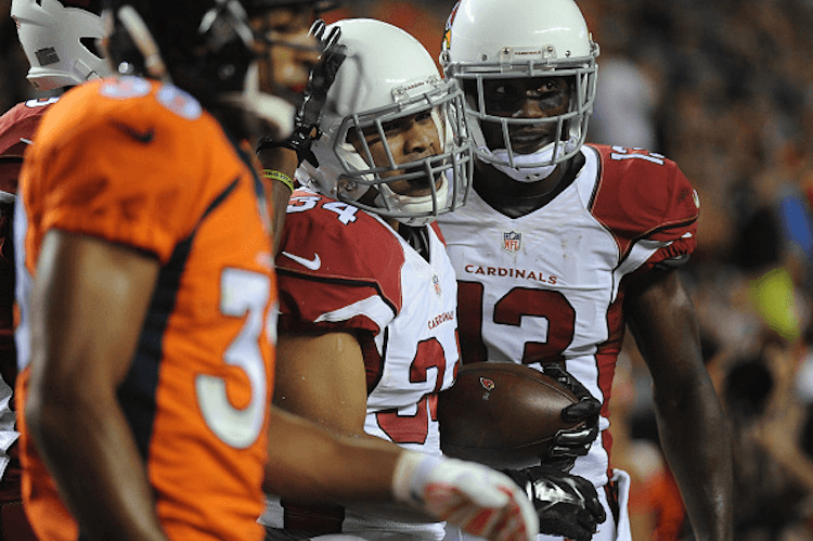 Paul Lasike after a TD for the Cardinals in a practice game. Not long after, he was cut. (Photo by Steve Nehf/The Denver Post)