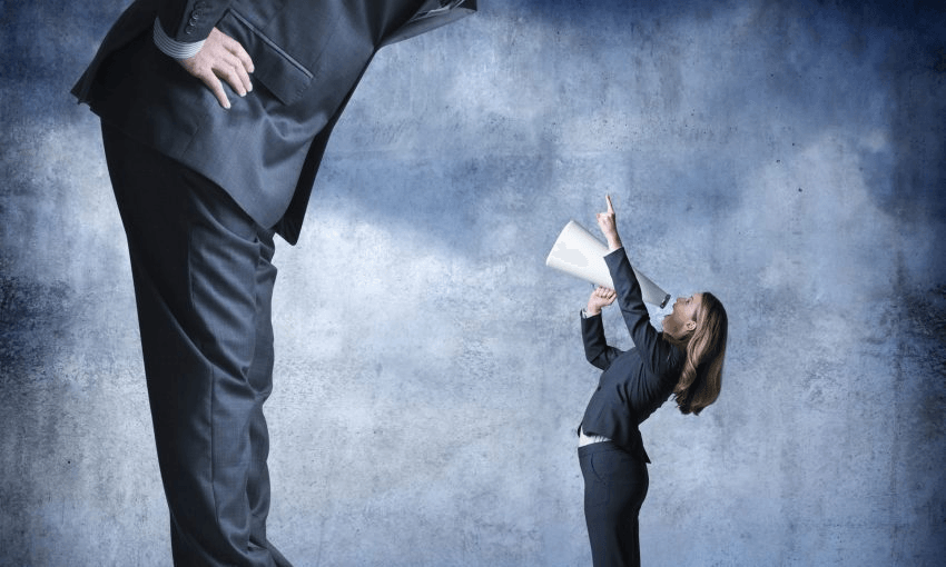 Businesswoman with megaphone solving pay inequity issues in the stock photo model industry. Photo: Getty 
