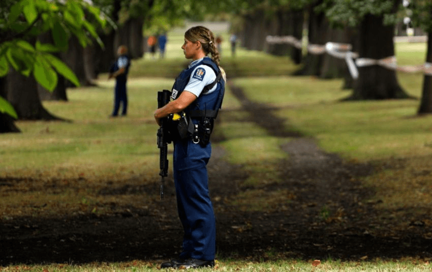 Police officers guard the area close to the Masjid al Noor mosque after the shooting in Christchurch on March 15, 2019. Photo: Tessa Burrows/AFP/Getty Images 
