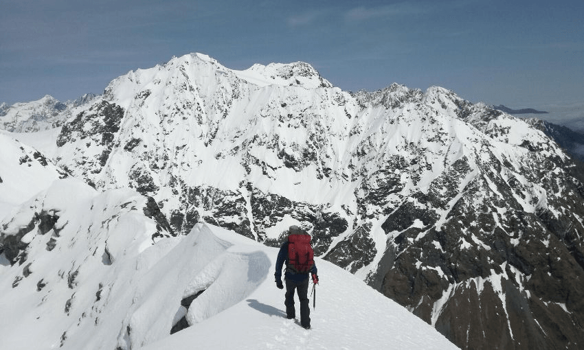 Nick Atkinson near Dennistoun Pass, with Mt Shyness prominent (Photo: Finn Scholes) 
