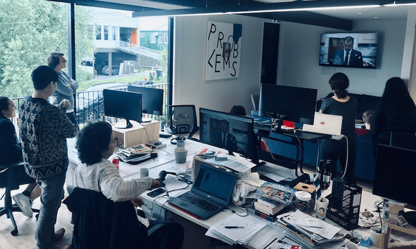 The Spinoff newsroom watches that Jami-Lee Ross press conference in 2018 (Photo: Duncan Greive) 
