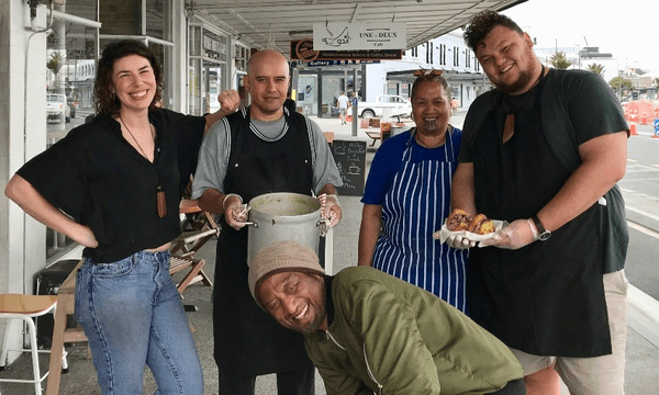 From left, Christy Tennent, Mike Hona, Taniko Ngamotu and Grayson Goffe, with Tiare Turetahi at front, outside Open Cafe with their boil-up (Photo: Charlotte Muru-Lanning) 
