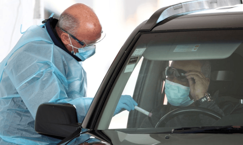 A man taking a Covid test in Auckland