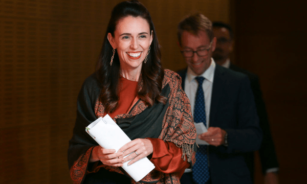 Jacinda Ardern and Ashley Bloomfield arrive at the Beehive press conference to announce the decision on alert levels. (Photo by Hagen Hopkins/Getty Images) 
